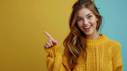 Young brunette woman wearing yellow sweater pointing to the left side side with copy space , female model looking at the camera smiling excitedly while showing something on the left