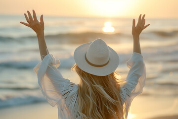 Woman in White Hat Embracing the Sun at Golden Hour by the Sea - 786907067