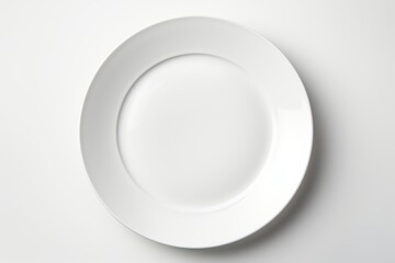 A white plate rests peacefully on a white table, creating a serene and minimalist composition