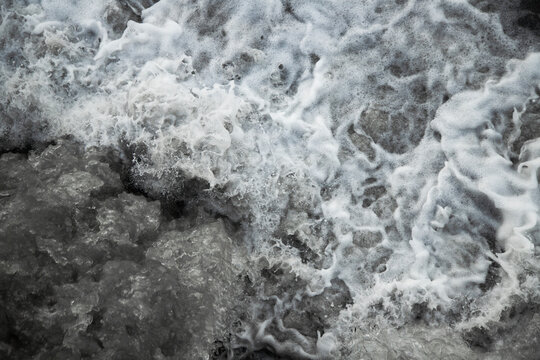 water waves of stormy mountain river with white foam . Abstract nature backgrounds