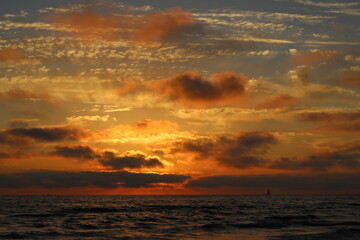 golden sunset, sunset in baltic sea,  lonely sailboat in the sea - obrazy, fototapety, plakaty