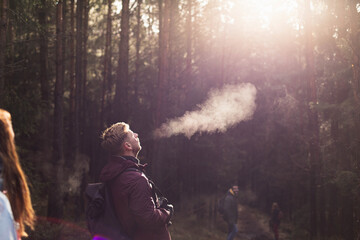 Young man exhaling warm air in cold hike.jpg