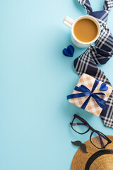 A vertical charming setup for Father's Day featuring a coffee cup, trendy glasses, and stylishly wrapped gifts on a pastel blue background