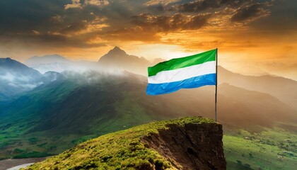 The Flag of Sierra Leone On The Mountain. - obrazy, fototapety, plakaty