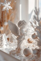Fototapeta premium A beautiful angel statue displayed on a table. Ideal for religious or home decor concepts