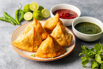 selective focus Samosa, Spiced potato-filled pastry, crispy, Savory, popular Indian snack with...