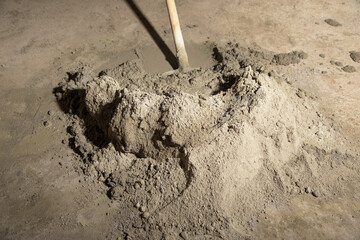 Shovel and concrete on a construction site.