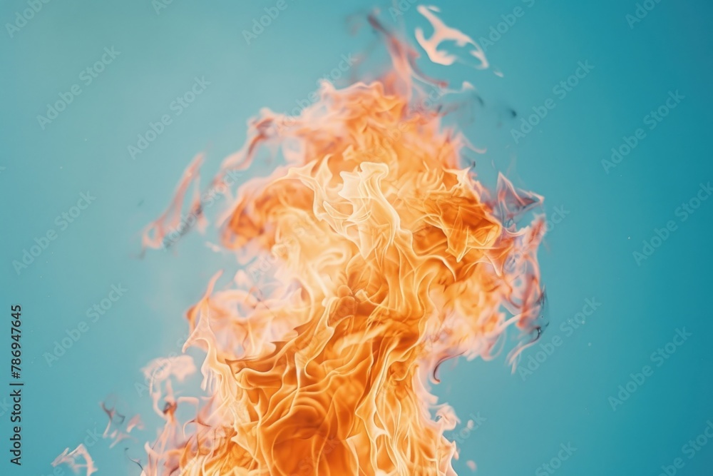 Poster close up of fire on blue background. ideal for backgrounds or abstract concepts