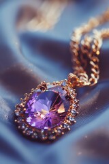 A close up of a purple necklace on a blue cloth. Ideal for fashion or jewelry concepts
