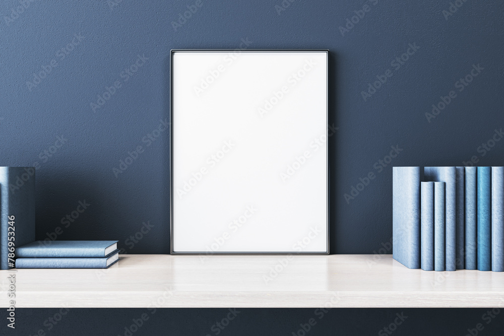 Poster close up of creative wooden designer desk with books and empty white mock up banner on blue concrete