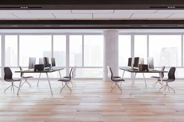 A modern office interior with tables, chairs, and computers against large windows overlooking a cityscape, light and spacious. 3D Rendering