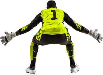 Back view of young African man in uniform, soccer player, goalkeeper standing in positing isolated on transparent background. Concept of sport, game, competition, tournament, active lifestyle