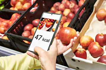 Checking calories on apple fruit with smartphone