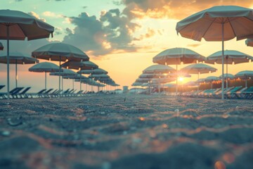Colorful umbrellas on a sandy beach, perfect for summer vacation concept. - obrazy, fototapety, plakaty