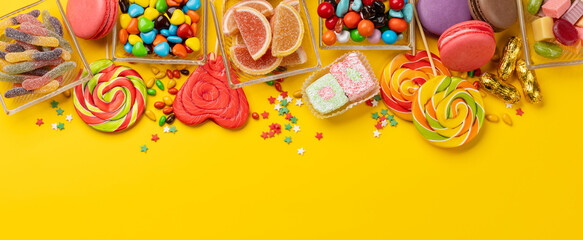Various colorful candies, lollipops, and macaroons