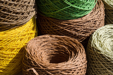 Raffia balls close-up. Skeins of multi-colored raffia are ready for knitting.