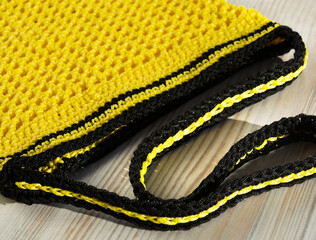 Yellow bag. Women's bag made of polyester cord for a table.