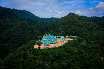 Aerial view of Wat Pa Phu Kon located in the middle of nature, surrounded by mountains in...