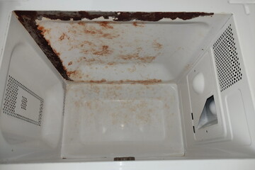 Rusty surface of the walls of the microwave oven when the microwave oven sparks - repair of...