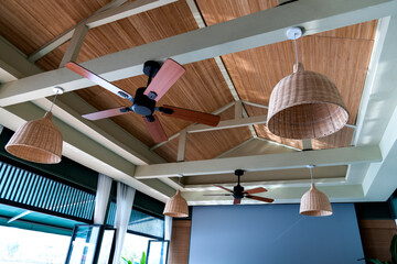 Wooden ceiling with lamps and fans