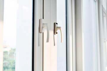 Close up of window with handles