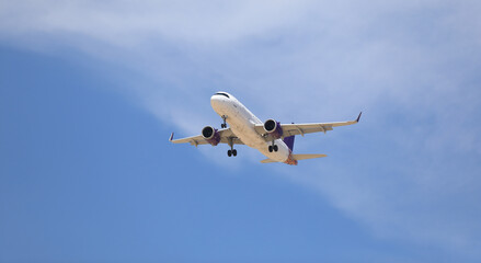 passenger plane in the blue sky - 786972095