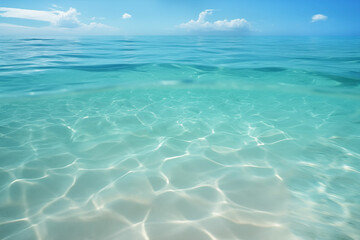 Sea sand under the transparent clear blue water.