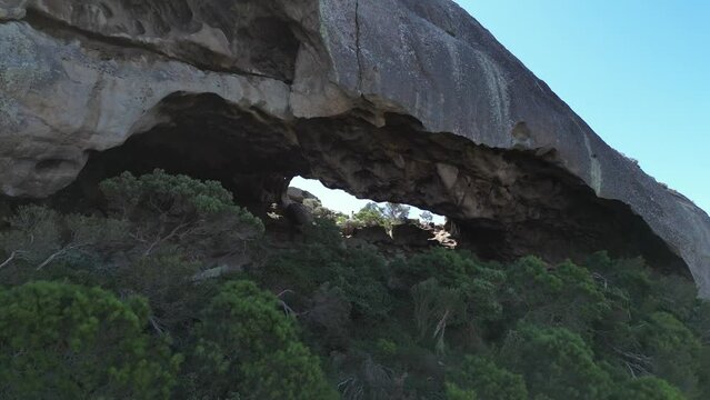 Cave on top of  Frenchman Mount, National Park near Esperance, Western Australia. Aerial forward