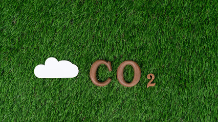 Arranged wooden alphabet text in CO2 on biophilic background with gases or cloud icon as eco symbol...