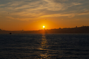 Sunset in Istanbul. Galata Tower and mosques in the photo