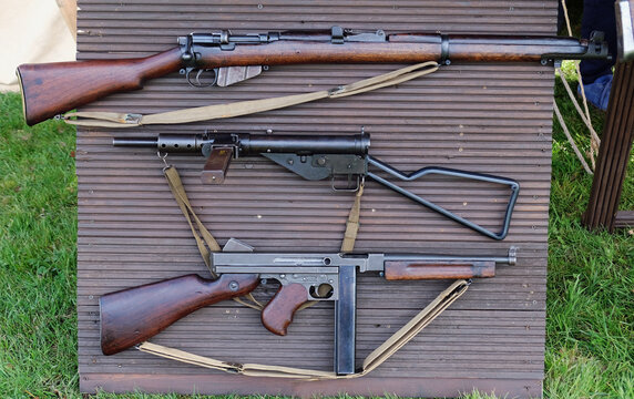 Vintage world war two infantry weapons. Lee Enfield Mk4 rifle, sten gun and Thompson gun.