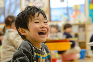 A Japanese boy grins with enthusiasm as he participates in an art and creativity class, embracing the opportunity for self-expression and exploration.