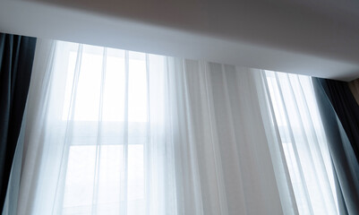 Room window with white curtain
