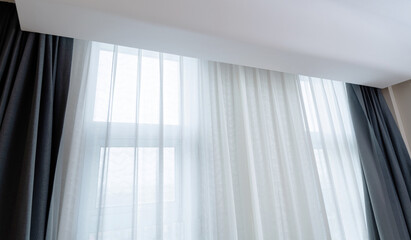 Room window with white curtain