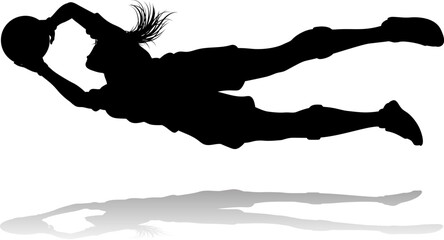 A female soccer football player woman in silhouettes