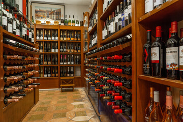 Interior and hallway of a luxurious liquor store, wines, champagne, brandies and cognac, displayed,...