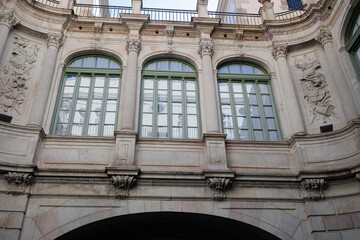 Fototapeta na wymiar Large Glass Windows of the The Virreina Palace, a building Located on the famous La Rambla avenue, Spain