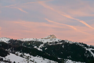 Sunset over the Mountains: Sky with Shades of Pink and Orange in Italian Dolomites Mountains Alps, Italy