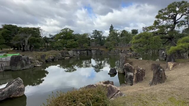 Cloudy Day Over Ninomaru Gardens Pond In Nijo Castle, Kyoto, Japan. Aerial Shot