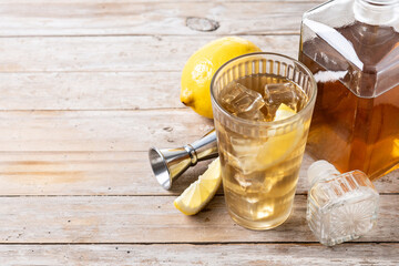 Highball, Whiskey with soda and lemon beverage on wooden table. Copy space - 787012237