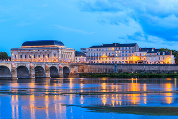 Saumur, France, located at the Loire river during dusk - obrazy, fototapety, plakaty