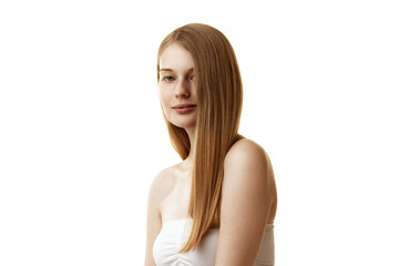 Portrait of confident, beautiful young woman looking at camera demonstrating her long, healthy hair against white studio background. Concept of natural beauty, organic cosmetic, procedures, hair-care.