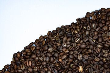 curved coffee beans on white background