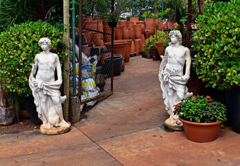 Gypsum statues at the entrance to a plant and pot store