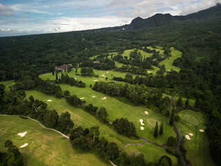 Golf Course on a cloudy day in Yogyakarta on the Merapi Mountainside. Wide golf field in Indonesia.
