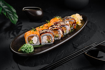 Gourmet sushi roll on elegant black plate