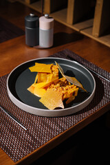 Gourmet pumpkin ravioli on elegant table setting