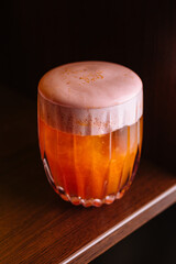 Frothy craft beer in glass