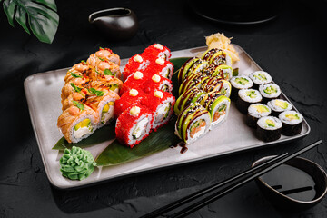 Assorted sushi platter on dark table