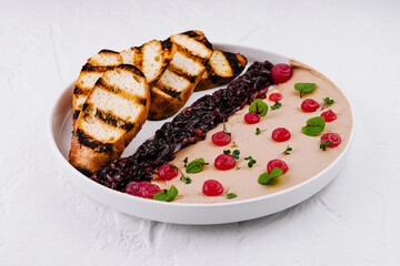Gourmet chicken liver pate with berry compote and grilled bread